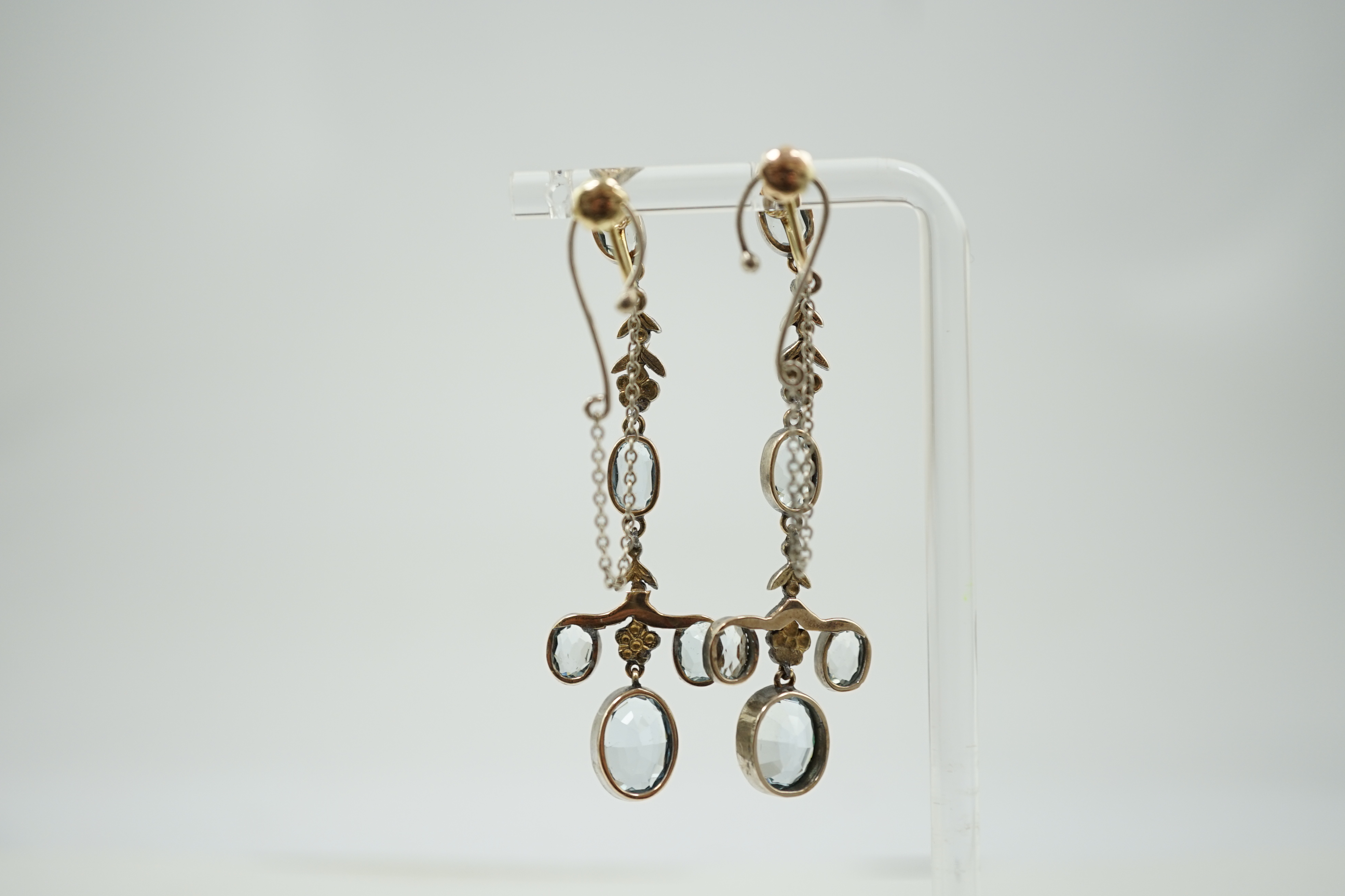 A pair of Belle Epoque gold and silver, aquamarine, rose cut diamond and emerald cluster set drop ear clips